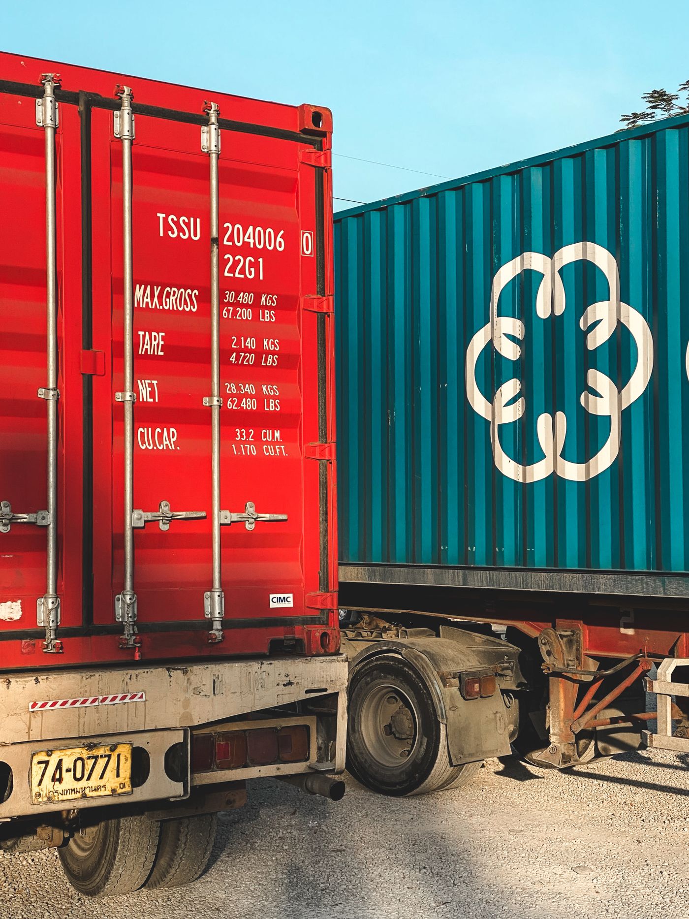 Shipping containers on transport trailers